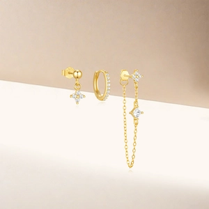 Detail view of gold S925 sterling silver earrings set with zircon and long tassel