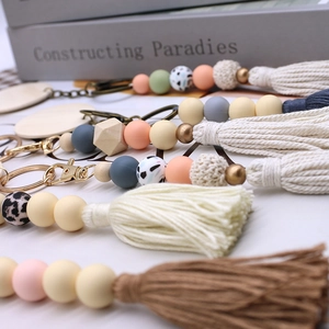 Nordic style beaded keychain featuring silicone beads, wood elements and cotton tassels
