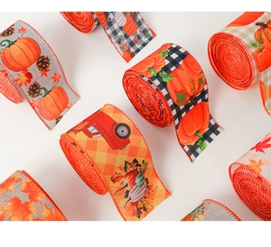 Detail of autumn harvest ribbons featuring maple leaf, pumpkin, and buffalo plaid patterns