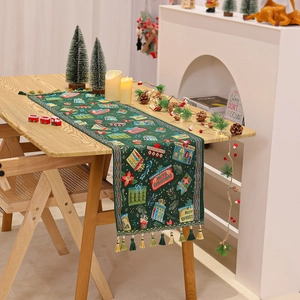 Detail of dark green Chenille Christmas table runner with tassels and Merry Christmas print