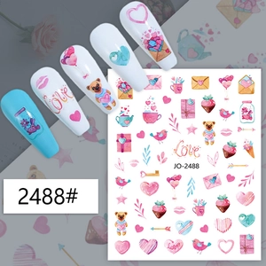 Close-up of Valentine's Day nail stickers with hearts, balloons, and bear motifs
