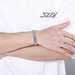 Close-up of polished 10mm stainless steel watchband link bracelet on male model wrist