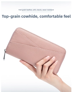 Detail of soft pink top grain cowhide leather wallet with lychee grain texture
