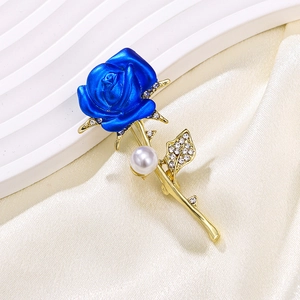 Elegant blue rose brooch with gold leaves, clear rhinestones and a white pearl accent