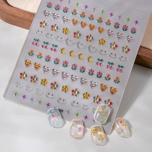3D relief nail stickers featuring colorful embossed flowers, hearts, and smiley faces
