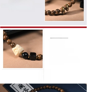 Detailed macro view of sandalwood beads with ornate carved accents and metallic rings