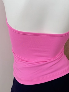 Detail view of the pink knitted halter top back design on a mannequin stand