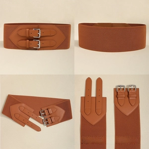Macro shot of brown elastic wide waist belt with double pin buckle and faux leather detail