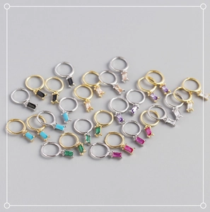 Detail of S925 sterling silver hoop earrings with colorful rectangular zirconia drops