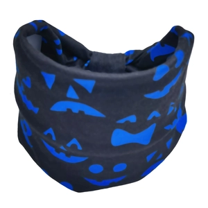 Close-up of Halloween headband featuring blue pumpkin patterns on black fabric