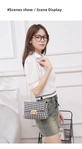 Close-up of houndstooth crossbody bag with gold chain strap and metal swivel lock detail