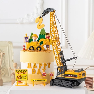 Construction site cake decorations with crane, excavator and traffic signs for kids