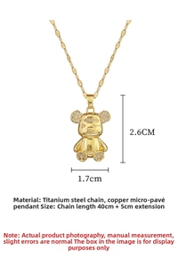 Macro shot of gold teddy bear pendant with micro-zirconia details on titanium steel chain