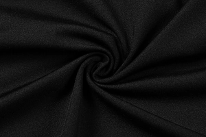 Close-up of black knitted fabric texture with soft elasticity and slight sheen finish