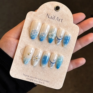 Blue and white gradient almond press-on nails with 3D floral and pearl decorations