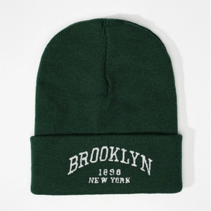Dark green Brooklyn 1898 New York embroidered beanie with a classic ribbed knit design
