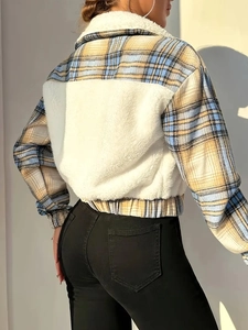 Back view of women's contrast plaid jacket with warm white fleece and blue yellow patterns