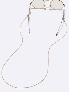 Golden round metal frame glasses with matching thin metal chain on white background