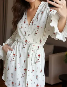 Detail of white long-sleeve cherry bathrobe with rabbit print and ruffled cuffs design