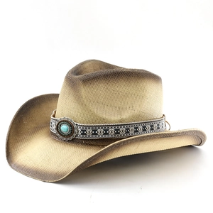 Detail of western straw cowboy hat featuring ethnic band and turquoise stone ornament