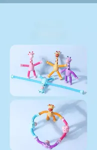 Close-up of flexible suction cup legs and corrugated tubes on colorful giraffe toys