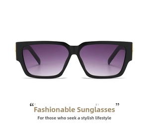 Detail of square black frame sunglasses with purple gradient lenses and gold accents