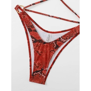Women's halter one-piece swimsuit featuring a bold red snakeskin print and side straps