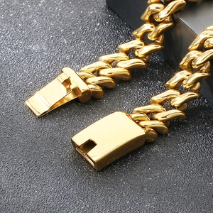 Macro shot of 15mm gold-plated Cuban link chain showing the secure box clasp detail