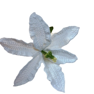 Handmade white crochet lily flower with yellow stamens and green stem on white background