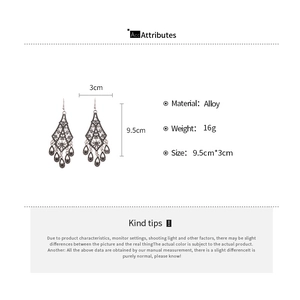 Detail view of vintage alloy hollow flower earrings with teardrop tassels and size specs