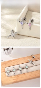 Macro shot of titanium steel sword studs with opal hearts on wooden display stands