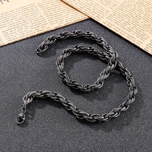Close-up of vintage industrial steel chain with lobster clasp on dark textured background