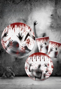 Detailed view of Halloween paper plates and cups with red blood splatter design