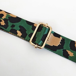 Detail of high-density nylon leopard print strap with golden metal adjustment buckle