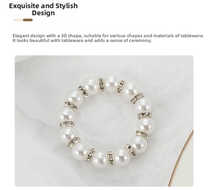 Detail of luxury napkin ring with glossy white pearls and sparkling rhinestone spacers