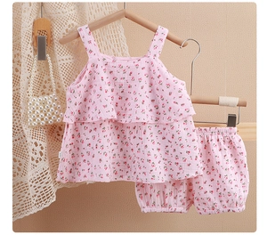 Detail of pink floral cotton toddler set with ruffled tank top and bloomer shorts