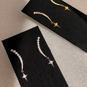 Star pendant earrings with sparkling cubic zirconia in silver and gold minimalist design