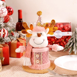 Pink Christmas reindeer candy box with sequins and plush scarf in a festive holiday setting