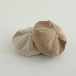 Detailed knit texture of beige and khaki cat ear berets for toddlers in high-quality wool