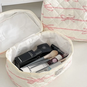Pink bow quilted makeup bag set featuring a soft white fabric with floral bow pattern