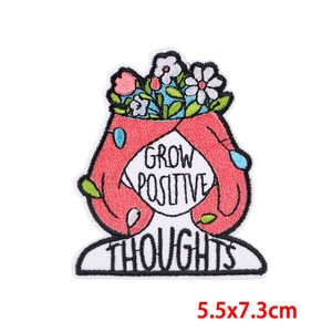 Detail showing Grow Positive Thoughts embroidered patch with floral design and 5.5x7.3cm size