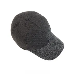 Detailed top view of men's winter baseball cap with knit texture and ear protection flaps