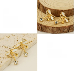 Detail showing bowknot earrings with shell inlay, rhinestones, and star drop details