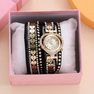 Women's quartz watch with gold heart dial and layered black strap in a pink gift box