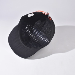 Internal view of a black quick-dry outdoor cap showing breathable lining and strap