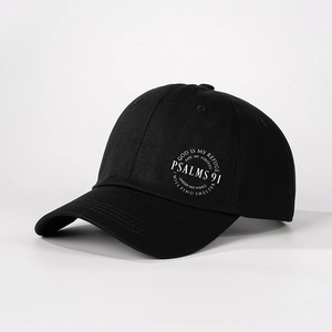 Detailed macro view of PSALMS 91 religious print on a black cotton baseball cap