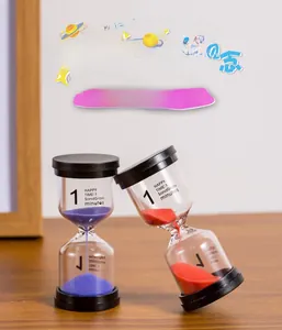 Detail of 1-minute hourglass with purple sand on a wooden table for home decor