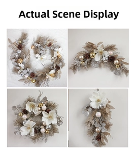 Detailed view of Magnolia Christmas wreath set with pine cones and golden ornaments