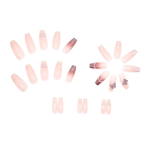 Pink gradient press-on nails with 3D butterflies, pearls, and glitter in long coffin shape