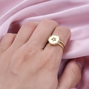 18k gold plated stainless steel double-layer ring with star motif on pink silk background